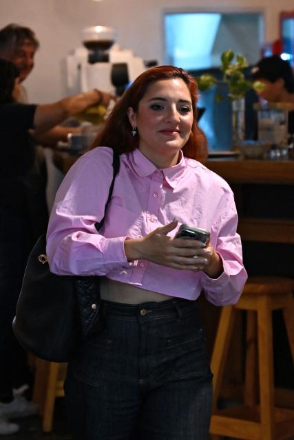 Jana Maradona, daughter of late Argentine football legend Diego Maradona, arrives at a preliminary trial hearing for his death in San Isidro, Buenos Aires province, on December 2, 2025. A court in Buenos Aires will decide on Tuesday, during a preliminary hearing how a new trial will be conducted for the death of Diego Maradona in 2020, following the annulment of the first trial. The scheduled start date has been set for March 17, 2026, although appeals by the defence teams of the seven accused health professionals still need to be addressed, which could delay the start. (Photo by Luis ROBAYO / AFP)