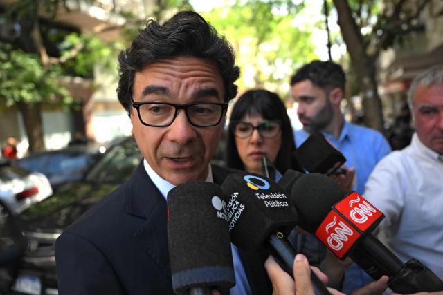 Vadim Mischanchuk, lawyer of psychiatrist Agustina Cosachov, speaks to the press outisde the court before a preliminary trial hearing on late Argentine football legend Diego Maradona's death in San Isidro, Buenos Aires provice, on December 2, 2025. A court in Buenos Aires will decide on Tuesday, during a preliminary hearing how a new trial will be conducted for the death of Diego Maradona in 2020, following the annulment of the first trial. The scheduled start date has been set for March 17, 2026, although appeals by the defence teams of the seven accused health professionals still need to be addressed, which could delay the start. (Photo by Luis ROBAYO / AFP)