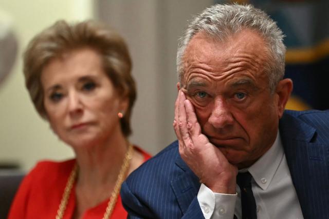 (L-R) US Secretary of Education Linda McMahon and US Secretary of Health and Human Services Robert F. Kennedy Jr., look on during a Cabinet Meeting in the Cabinet Room of the White House in Washington, DC on December 2, 2025. (Photo by ANDREW CABALLERO-REYNOLDS / AFP)