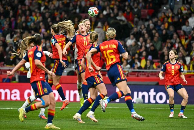 Spain's midfielder #11 Alexia Putellas (C) goes for a header during the UEFA Women's Nations League second leg final football match between Spain and Germany at the Metropolitano Stadium in Madrid on December 2, 2025. (Photo by Javier SORIANO / AFP)