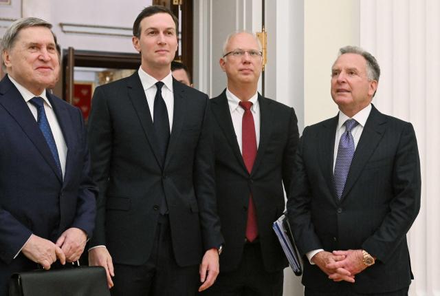 In this pool photograph distributed by the Russian state agency Sputnik, US special envoy Steve Witkoff and US President Donald Trump's son-in-law Jared Kushner, accompanied by Kremlin aide Yuri Ushakov and Kremlin economic envoy Kirill Dmitriev, are seen prior to a meeting with Russia's President at the Kremlin in Moscow on December 2, 2025. (Photo by Kristina Kormilitsyna / POOL / AFP)