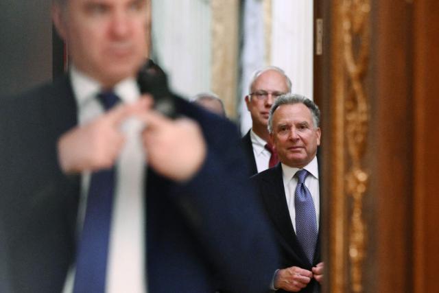 In this pool photograph distributed by the Russian state agency Sputnik, US special envoy Steve Witkoff, accompanied by Kremlin economic envoy Kirill Dmitriev, is seen prior to a meeting with Russia's President at the Kremlin in Moscow on December 2, 2025. (Photo by Kristina Kormilitsyna / POOL / AFP)