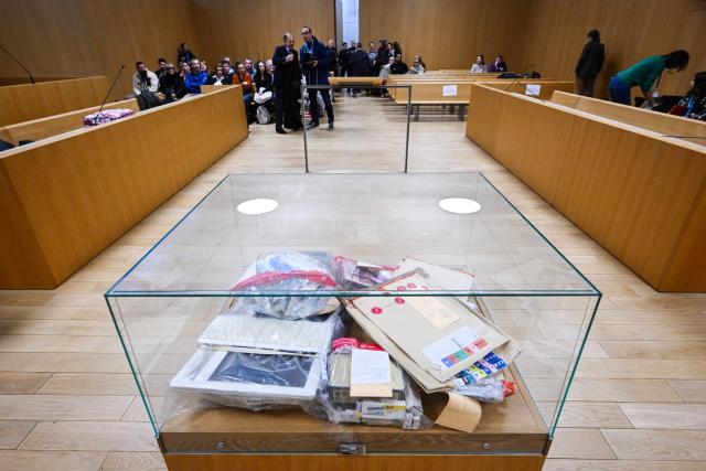 (FILES) A photograph taken on November 24, 2025 shows evidences displayed in the courtroom of the Assize Court of the Landes department, in Mont-de-Marsan, in southwestern France, prior to the start of the trial of Maylis Daubon, charged with poisoning her two daughters, one of whom died. The trial of Maylis Daubon, 53, accused of poisoning her two daughters, one of whom died, by drugging them, then attempting to have their father murdered from prison, is expected to conclude on December 3, 2025. Maylis Daubon has maintained since her indictment and imprisonment in January 2022 that her eldest daughter, who died at the age of 18, committed suicide. (Photo by Gaizka IROZ / AFP)