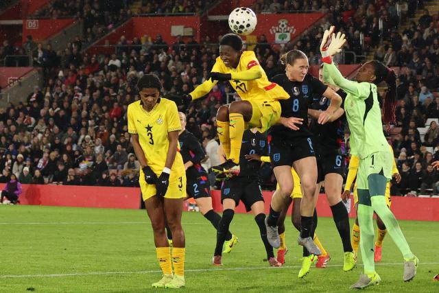 Ghana's defender #17 Portia Boakye (C) jumps to make a header during the women's International football friendly match between England and Ghana at St Mary's Stadium in Southampton, southern England on December 2, 2025. (Photo by Adrian DENNIS / AFP)