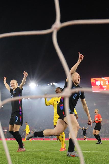England's midfielder #08 Lucia Kendall (R) celebrates after scoring the opening goal during the women's International football friendly match between England and Ghana at St Mary's Stadium in Southampton, southern England on December 2, 2025. (Photo by Adrian DENNIS / AFP)