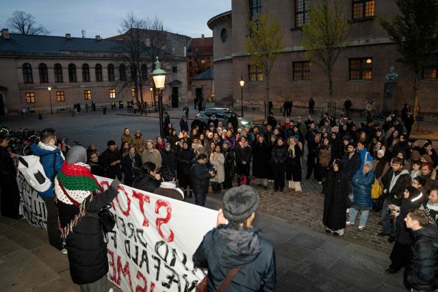 Participants display banners during a demonstration against the closure of quiet rooms at the KU, University of Copenhagen, in front of the Rectorate at Frue Plads in Copenhagen on December 2, 2025. A group of students is demonstrating against the closure of the quiet rooms. The rooms have been controversial as particularly Muslim students have benefited from them, but the criticism has been that they have been used for the control of particularly female Muslim students. (Photo by Sebastian Elias Uth / Ritzau Scanpix / AFP) / Denmark OUT