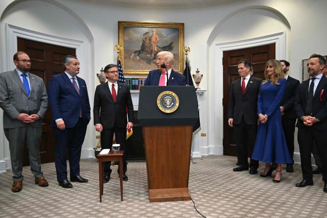 US President Donald Trump announces a $6.25 billion donation from Michael Dell (center-R), CEO of Dell Technologies and his wife Susan (3rd-R) to “Trump Accounts,” in the Roosevelt Room of the White House in Washington, DC on December 2, 2025. The donation will be intended to fund investment accounts for at least 25 million American children. (Photo by ANDREW CABALLERO-REYNOLDS / AFP)