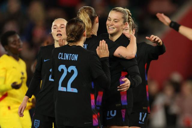 England's striker #16 Alessia Russo (R) celebrates with teammates after scoring their second goal from the penalty spot during the women's International football friendly match between England and Ghana at St Mary's Stadium in Southampton, southern England on December 2, 2025. (Photo by Adrian Dennis / AFP)