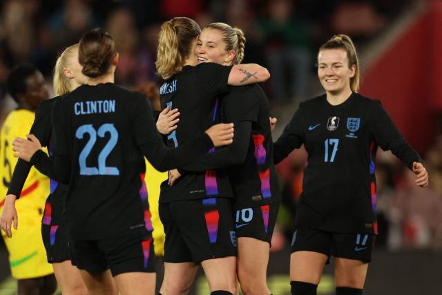 England's striker #16 Alessia Russo (2R) celebrates with teammates after scoring their second goal from the penalty spot during the women's International football friendly match between England and Ghana at St Mary's Stadium in Southampton, southern England on December 2, 2025. (Photo by Adrian Dennis / AFP)