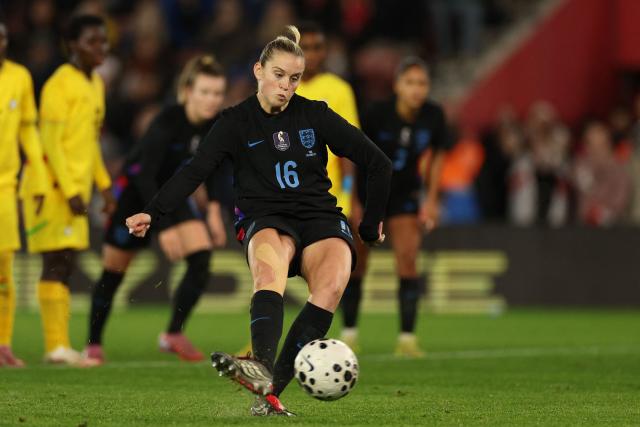 England's striker #16 Alessia Russo scores their second goal from the penalty spot during the women's International football friendly match between England and Ghana at St Mary's Stadium in Southampton, southern England on December 2, 2025. (Photo by Adrian Dennis / AFP)