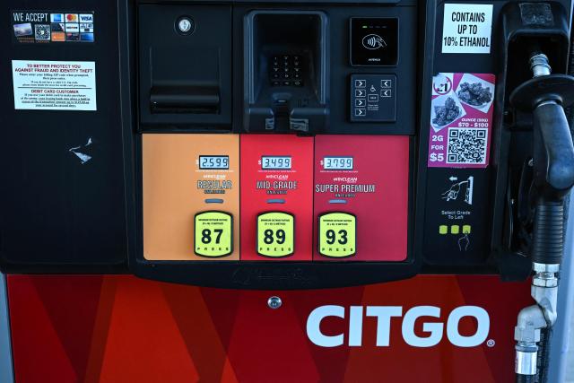 Gas pumps are seen at a CITGO gas station in Houston, Texas, on December 2, 2025. Venezuela on December 2, 2025 denounced what it called the "forced sale" of its most valuable overseas asset, oil company Citgo, after a US court authorized the transaction to pay off creditors. Citgo, a Houston-based subsidiary of Venezuela's PDVSA state oil company, is in the crosshairs of creditors seeking the settlement of debts in excess of $20 billion that cash-strapped Caracas has been unable or unwilling to pay. (Photo by RONALDO SCHEMIDT / AFP)
