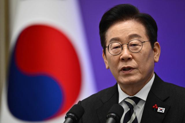 South Korea President Lee Jae Myung holds a press conference at the Blue House in Seoul on December 3, 2025, the first anniversary of the declaration of martial law by ousted president Yoon Suk Yeol.  (Photo by ANTHONY WALLACE / AFP)