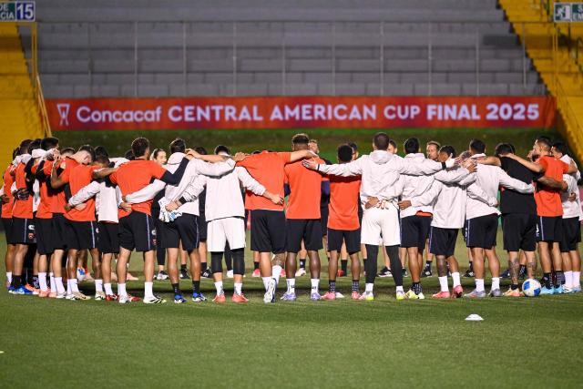 Alajuelense players gather in a circle before a training session at Cementos Progreso Stadium in Guatemala City on December 2, 2025. (Photo by Johan ORDONEZ / AFP)