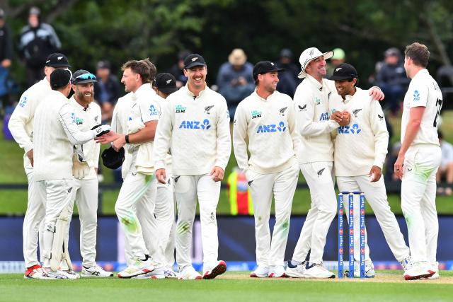 New Zealand players celebrate the wicket of West Indies' Shai Hope during day two of the first Test cricket match between New Zealand and West Indies at Hagley Oval in Christchurch on December 3, 2025. (Photo by Sanka Vidanagama / AFP)