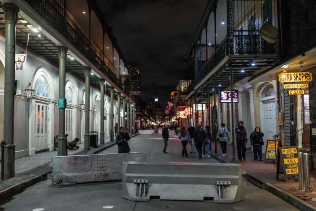 Concrete barriers block vehicle access to the pedestrian area of Bourbon Street in New Orleans, Louisiana, on December 2, 2025. According to US media reports, US Immigration and Customs Enforcement (ICE) and US Customs and Border Patrol are expected to begin a large-scale immigration enforcement operation known as "Swamp Sweep" in Southern Louisiana and Mississippi. (Photo by Adam GRAY / AFP)