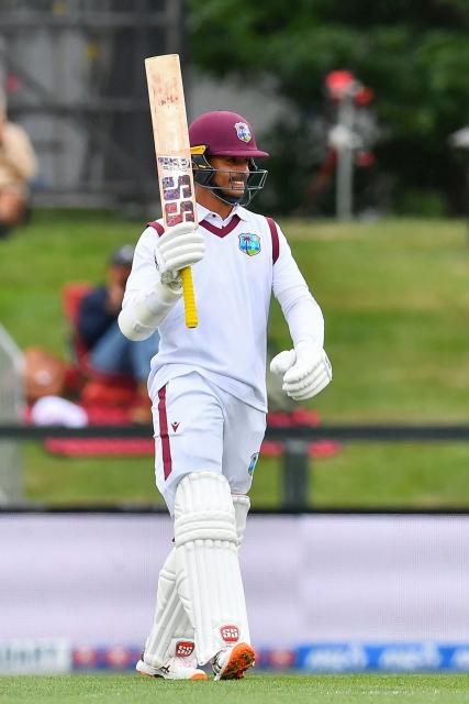 West Indies' Tagenarine Chanderpaul celebrates his half century during day two of the first Test cricket match between New Zealand and West Indies at Hagley Oval in Christchurch on December 3, 2025. (Photo by Sanka Vidanagama / AFP)