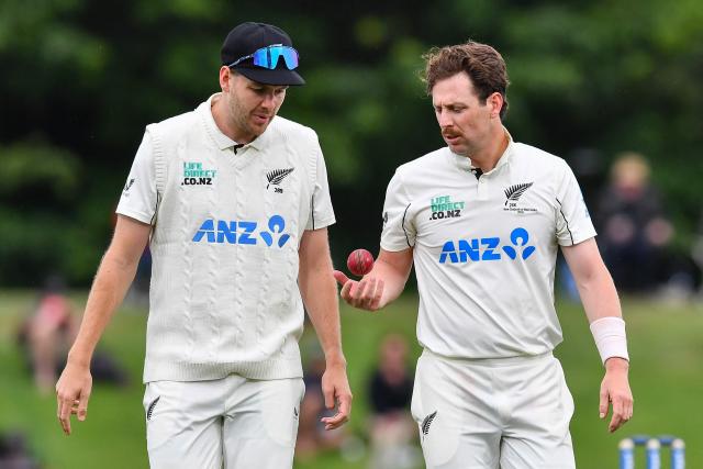 New Zealand's Matt Henry (R) talks with his teammate Jacob Duffy during day two of the first Test cricket match between New Zealand and West Indies at Hagley Oval in Christchurch on December 3, 2025. (Photo by Sanka Vidanagama / AFP)