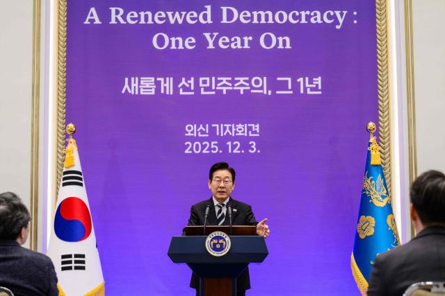 South Korea President Lee Jae Myung gestures as he holds a press conference at the Blue House in Seoul on December 3, 2025, on the first anniversary of the declaration of martial law by ousted president Yoon Suk Yeol. (Photo by ANTHONY WALLACE / AFP)
