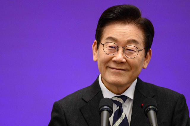 South Korea President Lee Jae Myung holds a press conference at the Blue House in Seoul on December 3, 2025, the first anniversary of the declaration of martial law by ousted president Yoon Suk Yeol. (Photo by ANTHONY WALLACE / AFP)