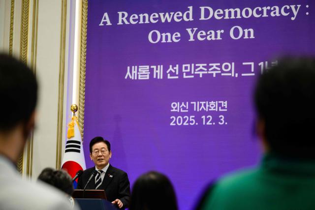 South Korea President Lee Jae Myung holds a press conference at the Blue House in Seoul on December 3, 2025, on the first anniversary of the declaration of martial law by ousted president Yoon Suk Yeol. (Photo by ANTHONY WALLACE / AFP)