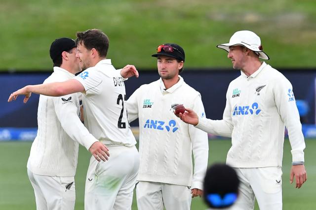 New Zealand's Jacob Duffy (2nd L) celebrates the wicket of West Indies' Ojay Shields with his teammates during day two of the first Test cricket match between New Zealand and West Indies at Hagley Oval in Christchurch on December 3, 2025. (Photo by Sanka Vidanagama / AFP)