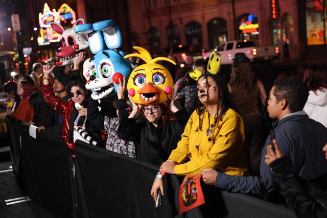 Fans in costumes attend the premiere of Universal Pictures' "Five Nights at Freddy's 2" at the TCL Chinese theatre in Hollywood, California on December 2, 2025. (Photo by Patrick T. Fallon / AFP)