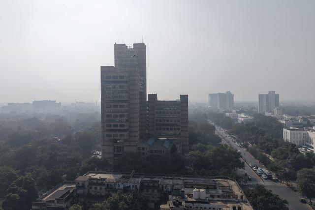 Smog engulfs the skyline in New Delhi on December 3, 2025. (Photo by Sajjad HUSSAIN / AFP)