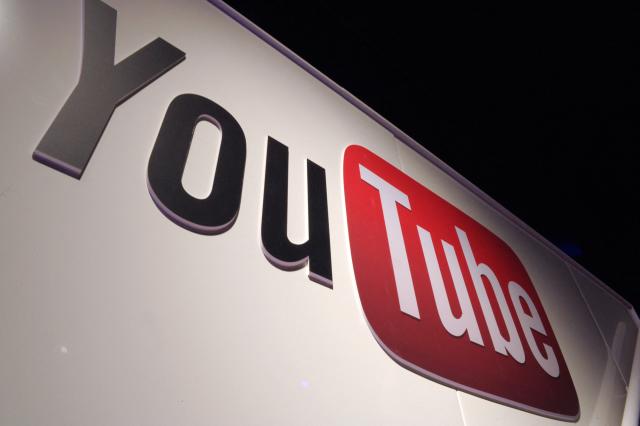 (FILES) In this file photo taken on December 04, 2012, a YouTube logo is pictured during LeWeb Paris 2012 in Saint-Denis near Paris. YouTube on December 3, 2025 attacked Australia's looming social media ban for under-16s, denouncing the world-first laws as "rushed" and saying they will make children less safe online. (Photo by Eric PIERMONT / AFP)