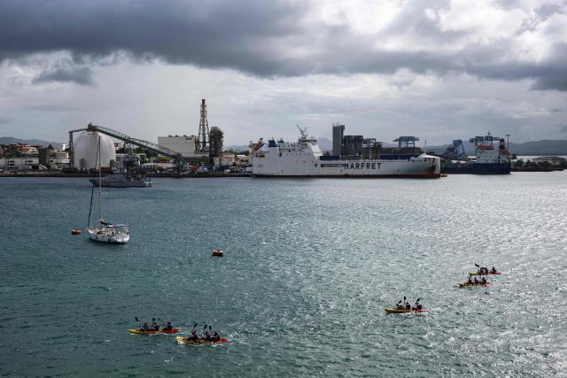 Competitors take part in a Kayak race of the "Raid des Alizes", an exclusively all-female multi sport competition, on the French Caribbean island of Martinique, on November 26, 2025. The all-female event features running, mountain biking, kayaking, and trekking events with each team representing a charity project of their choice with the overall ranking determining the prize money which will be directly donated to the charities. (Photo by Anne-Christine POUJOULAT / AFP)