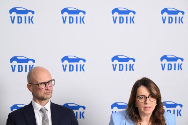 President of German Automobile Association VDIK Imelda Labbe (R) and  German Automobile Association VDIK head of unit politics/communication Stefan Meyer attend the Annual Conference of the German Automobile Association VDIK in Frankfurt am Main, on December 3, 2025. (Photo by Kirill KUDRYAVTSEV / AFP)