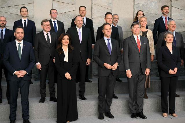 NATO Secretary General Mark Rutte (C) and participants pose for a family photograph following a meeting of NATO Ministers of Foreign Affairs at NATO headquarters in Brussels on December 3, 2025. (Photo by NICOLAS TUCAT / AFP)