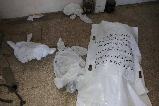 A labelled body bag containing the remains of identified Palestinians killed during Israel-Gaza war, waits to be collected at the morgue of the Al-Aqsa Hospital in Deir al-Balah, in the central Gaza Strip, on December 3, 2025. The war was sparked by Hamas militant's October 7, 2023 attack on Israel, which resulted in the deaths of 1,221 people. Israel's retaliatory assault on Gaza has killed at least 69,733 people, according to figures from the health ministry that the UN considers reliable. (Photo by Bashar Taleb / AFP)