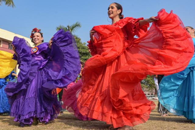 Colombian artists perform a dance during the International Cultural Folk Festival in Amritsar on December 3, 2025. (Photo by Narinder NANU / AFP)