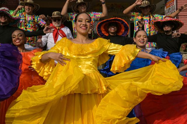 Colombian artists perform a dance during the International Cultural Folk Festival in Amritsar on December 3, 2025. (Photo by Narinder NANU / AFP)