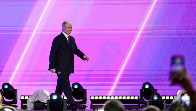In this pool photograph distributed by the Russian state agency Sputnik, Russia's President Vladimir Putin attends a volunteer organisations forum in Moscow on December 3, 2025. (Photo by Yevgeny BIYATOV / POOL / AFP)