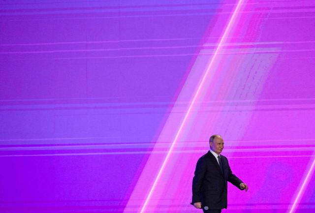 In this pool photograph distributed by the Russian state agency Sputnik, Russia's President Vladimir Putin attends a volunteer organisations forum in Moscow on December 3, 2025. (Photo by Yevgeny BIYATOV / POOL / AFP)