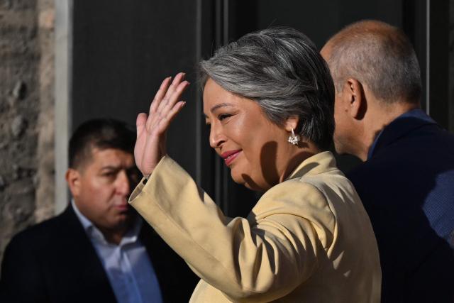Chile's presidential candidate Jeannette Jara of the Unidad por Chile coalition, waves upon her arrival for a debate organised by the Chilean Radio Association (Archi) in Santiago, on December 3, 2025. The clock is ticking down to a presidential run-off election on December 14, with far-right candidate Jose Antonio Kast the frontrunner to win the second round of voting against leftist Jeannette Jara. (Photo by RODRIGO ARANGUA / AFP)