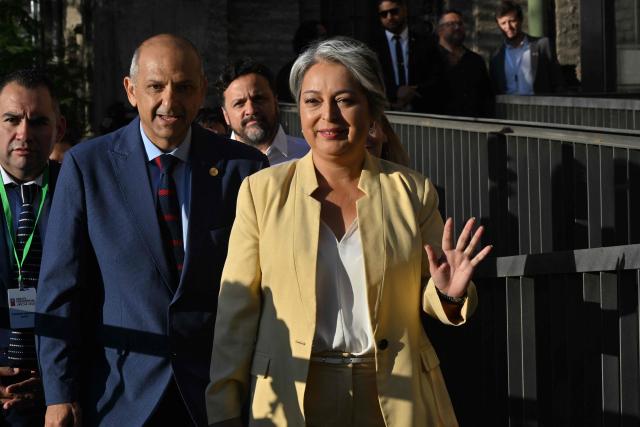 Chile's presidential candidate Jeannette Jara of the Unidad por Chile coalition, waves upon her arrival for a debate organised by the Chilean Radio Association (Archi) in Santiago, on December 3, 2025. The clock is ticking down to a presidential run-off election on December 14, with far-right candidate Jose Antonio Kast the frontrunner to win the second round of voting against leftist Jeannette Jara. (Photo by RODRIGO ARANGUA / AFP)