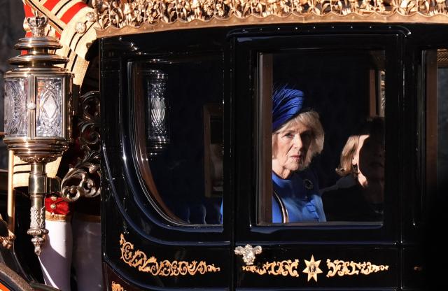 Britain's Queen Camilla and Wife of Germany's President Elke Buedenbender travel by horse-drawn carriage for a Ceremonial Welcome at Windsor Castle in Windsor, on December 3, 2025, the first day of a three day state visit by the German President. (Photo by Andrew Matthews / POOL / AFP)