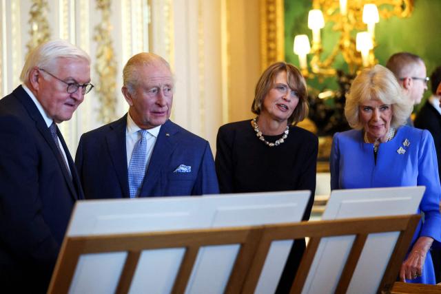 Germany's President Frank-Walter Steinmeier, Britain's King Charles III, Wife of Germany's President Elke Buedenbender and Britain's Queen Camilla view a special exhibition of items relating to Germany from the Royal Collection,  n the Green Drawing Room at Windsor Castle in Windsor, on December 3, 2025, the first day of a three day state visit by the German President. (Photo by Hannah McKay / POOL / AFP)