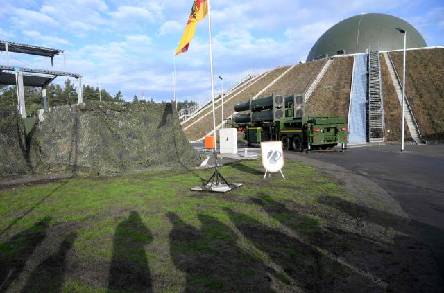 The Arrow 3 shield system and a radar dome are pictured during an event of the German Air Force to declare the Initial Operating Capability for the Arrow Weapon System for Germany at the Annaburger Heide Air Base in Schoenewalde / Holzdorf, eastern Germany, on December 3, 2025. The German military put the first parts of a roughly $4 billion Arrow 3 anti-missile shield system into service, aimed at bolstering Europe's air defences to counter Russian threats. The Arrow 3 shield system is part of the broader European Sky Shield effort launced in the wake of Russia's full-scale invasion of Ukraine, which raised alarm over possible gaps in NATO's European air defences. The German-Israeli deal to supply the Arrow 3 system inked in 2023 has been described as Israel's largest-ever military export contract. (Photo by RALF HIRSCHBERGER / AFP)