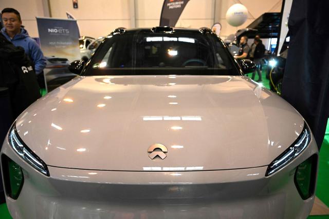 A car of Chinese electric vehicle manufacturer Nio is on display at the Essen Motor Show in Essen, western Germany on December 3, 2025. The Essen Motor Show, featuring the areas of performanc,e & racing, tuning & lifestyle, motorsport and classic cars, takes place from November 29 to December 7, 2025. (Photo by Ina FASSBENDER / AFP)