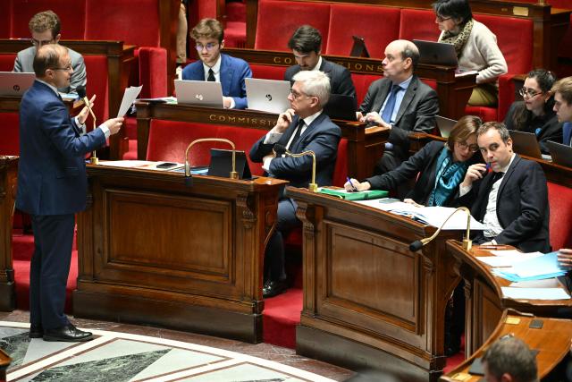 Droite Republicaine's MP and rapporteur for the committee on social affairs Thibault Bazin speaks in front of Horizons & Independants' MP and president of the committee on social affairs Frederic Valletoux (C), Public Accounts Minister Amelie de Montchalin (2ndR) and Prime Minister Sebastien Lecornu (R) during a session devoted to the second reading of the 2026 social security budget bill (PLFSS) at the National Assembly, the French Parliament lower house, in Paris on December 3, 2025. (Photo by Bertrand GUAY / AFP)