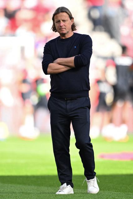 (FILES) Mainz' Danish head coach Bo Henriksen stands on the pitch prior to the German first division Bundesliga football match Mainz 05 v Bayer 04 Leverkusen in Mainz, southern Germany on October 18, 2025. According to German media reports on December 3, 2025, German first division club Mainz 05 has parted ways with coach Bo Henriksen. (Photo by Kirill KUDRYAVTSEV / AFP)