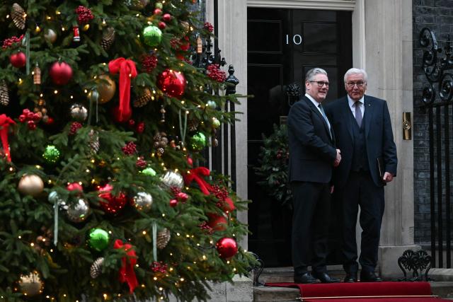 Britain's Prime Minister Keir Starmer greets Germany's President Frank-Walter Steinmeier outside 10 Downing Street in central London on December 3, 2025, the first day of a three day state visit by the German President. (Photo by JUSTIN TALLIS / POOL / AFP)