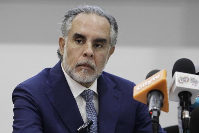 (FILES) The Minister of the Interior, Armando Benedetti, looks on during the presentation of the questions for the referendum sponsored by Colombian President Gustavo Petro in Bogota on April 22, 2025. Colombian Interior Minister Armando Benedetti said on December 3, 2025, that his phone was hacked with Pegasus spyware, made by Israeli firm NSO, amid a scandal involving the intelligence agency. (Photo by Andrea ARIZA / AFP)