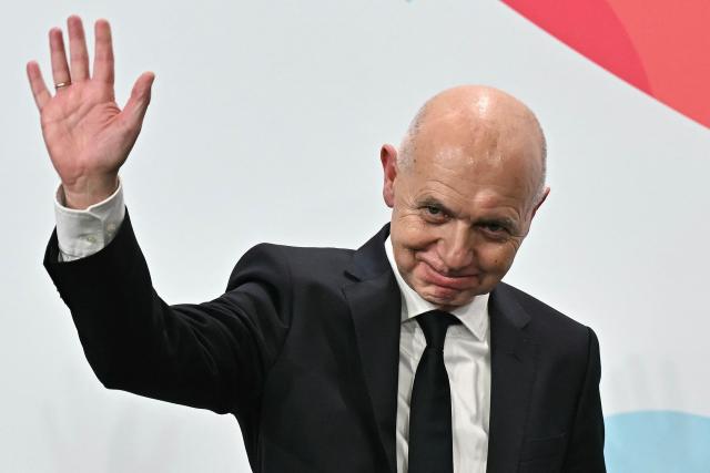 German Football Association (DFB) president Bernd Neuendorf waves to the audience after Germany was elected to host the UEFA Women's EURO 2029 fooball tournament during an announcement ceremony at the UEFA headquarters, the House of European Football, in Nyon on December 3, 2025.  (Photo by Fabrice COFFRINI / AFP)