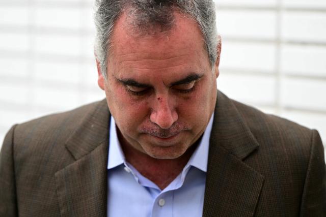 Peruvian presidential hopeful Rafael Belaunde of the Popular Liberty party leaves after a press conference in Lima on December 3, 2025. Peruvian presidential hopeful Rafael Belaunde escaped bloodied but not seriously hurt on December 2 from an attack by gunmen on his car south of the capital Lima, police said. (Photo by ERNESTO BENAVIDES / AFP)