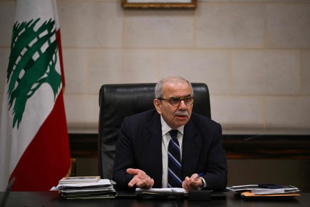 Lebanon's Prime Minister Nawaf Salam speaks to journalists working for foreign media and news agencies at the Government Palace in Beirut on December 3, 2025. (Photo by JOSEPH EID / AFP)