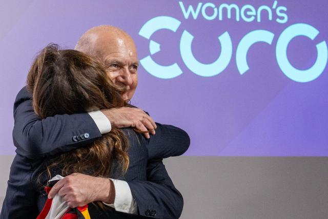 German Football Association (DFB) president Bernd Neuendorf (R) celebrates with UEFA director of Women's Football Nadine Kessler after Germany was elected to host the UEFA Women's EURO 2029 fooball tournament during an announcement ceremony at the UEFA headquarters, the House of European Football, in Nyon on December 3, 2025.  (Photo by Fabrice COFFRINI / AFP)